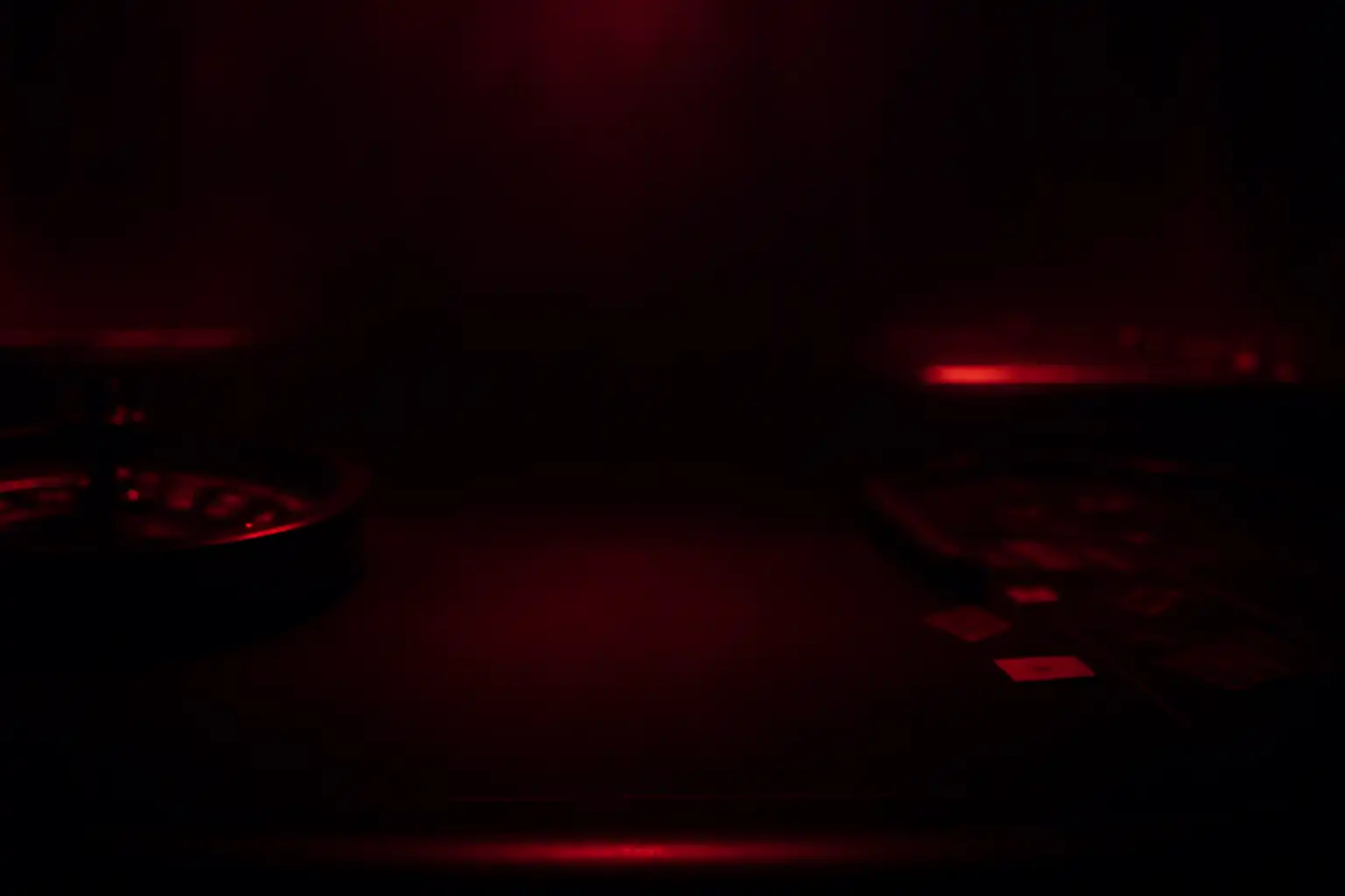 Ciemna scena kasyna Twindor z czerwonym neonowym oświetleniem i stołem do kart